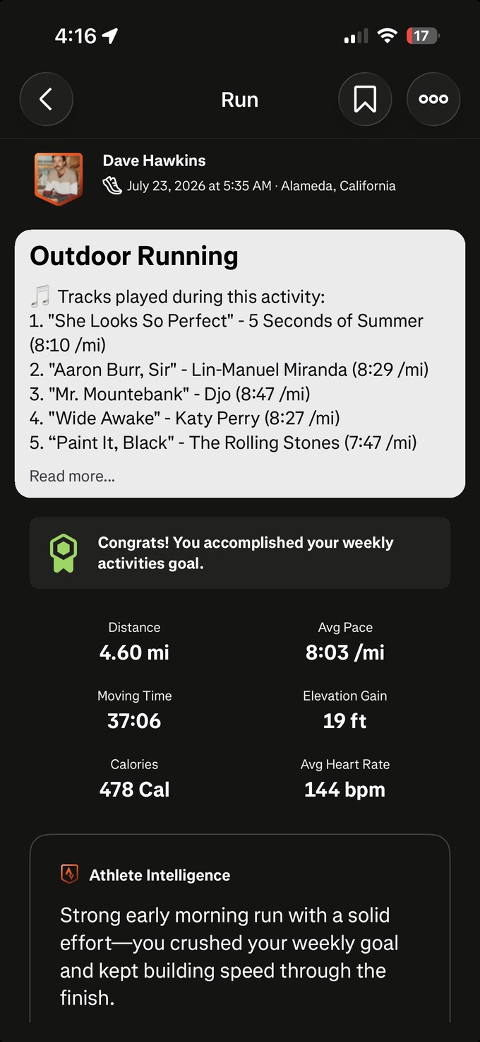 A real Strava run with the five songs played, each with its pace, listed in the description